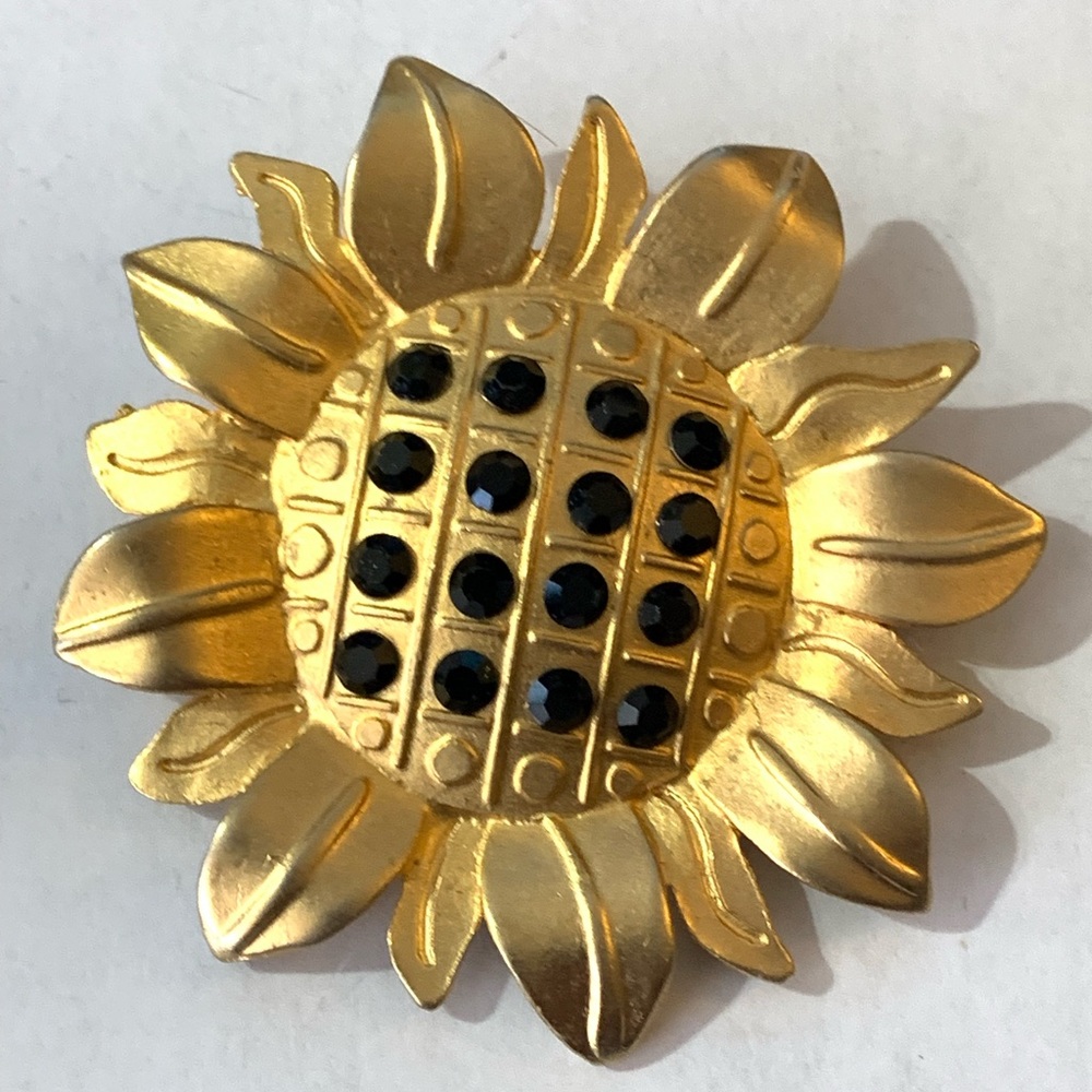 Vintages signed Newpro Gold tone, black rhinestone sun brooch